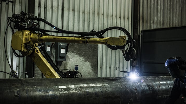 Groupe Gravel’s robot workcell performs plasma cutting and welding on large workpieces at the company’s Quebec facility