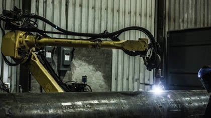 Groupe Gravel’s robot workcell performs plasma cutting and welding on large workpieces at the company’s Quebec facility